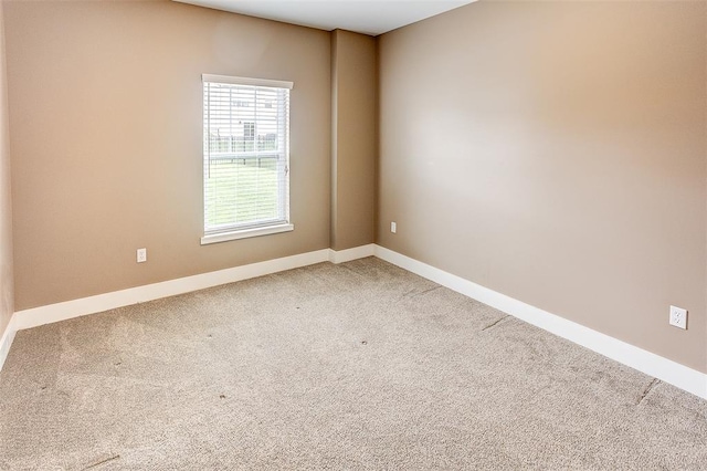 223 Ellington Ct, Glen Carbon, IL 62034 - empty room featuring baseboards and light carpet