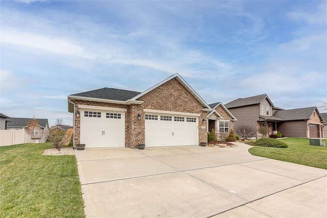 223 Ellington Ct, Glen Carbon, IL 62034 - view of front of home featuring a garage, brick siding, driveway, and a shingled roof