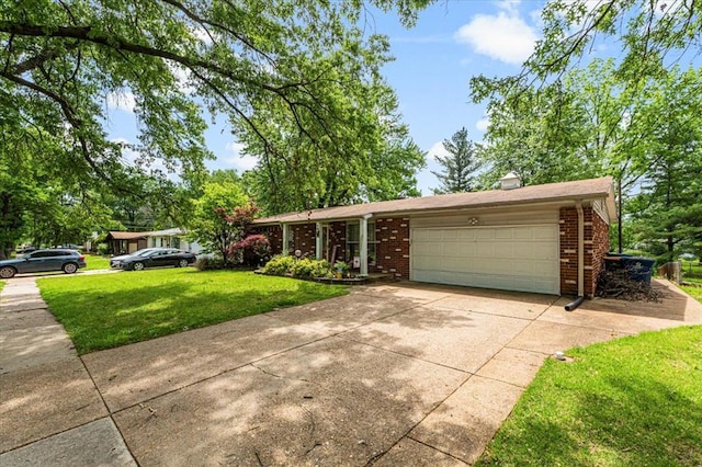 930 Laredo Ave, Saint Louis, MO 63138 - ranch-style house featuring brick siding, a front lawn, driveway, and a garage