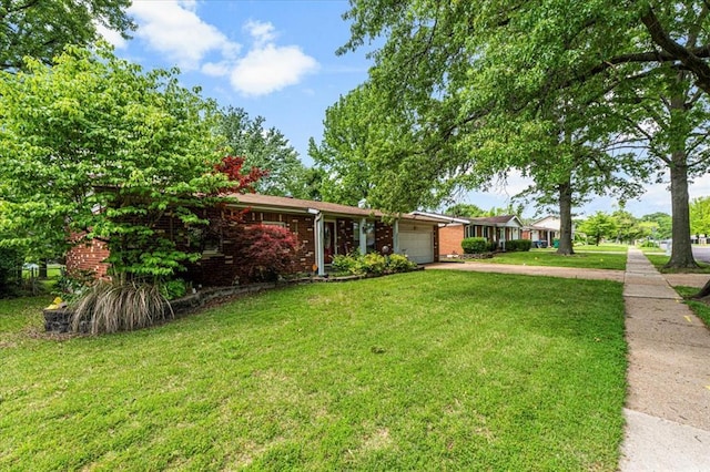 930 Laredo Ave, Saint Louis, MO 63138 - single story home with an attached garage, driveway, a front yard, and brick siding