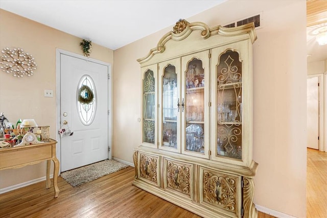 930 Laredo Ave, Saint Louis, MO 63138 - foyer with light wood-style floors and baseboards