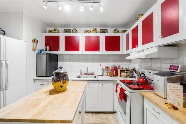 930 Laredo Ave, Saint Louis, MO 63138 - kitchen with white appliances, under cabinet range hood, a sink, wood counters, and crown molding