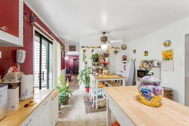 930 Laredo Ave, Saint Louis, MO 63138 - kitchen with a ceiling fan, ornamental molding, and white cabinetry