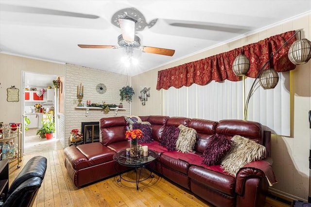 930 Laredo Ave, Saint Louis, MO 63138 - living room with wood-type flooring, ceiling fan, ornamental molding, and a fireplace