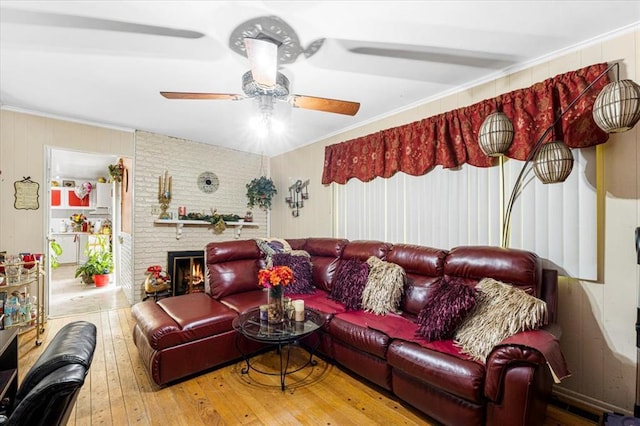 930 Laredo Ave, Saint Louis, MO 63138 - living area with hardwood / wood-style floors, ceiling fan, ornamental molding, and a fireplace