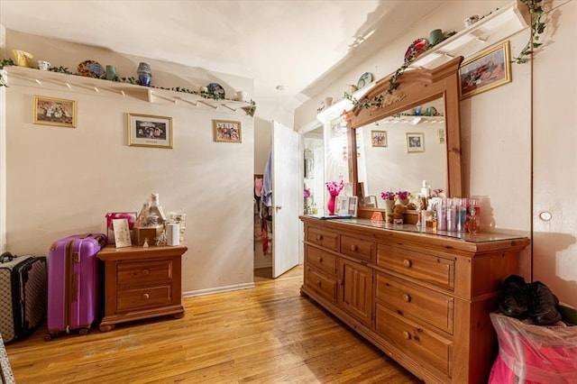930 Laredo Ave, Saint Louis, MO 63138 - bedroom with light wood-style flooring and baseboards