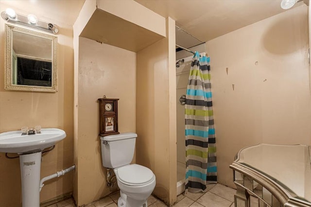 930 Laredo Ave, Saint Louis, MO 63138 - bathroom featuring tile patterned floors, toilet, and a shower with shower curtain