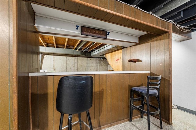 930 Laredo Ave, Saint Louis, MO 63138 - indoor dry bar with wood walls, light carpet, and baseboards
