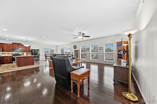 38 Crystal Manor Ct, Wentzville, MO 63385 - living room featuring ceiling fan, recessed lighting, hardwood / wood-style flooring, and baseboards