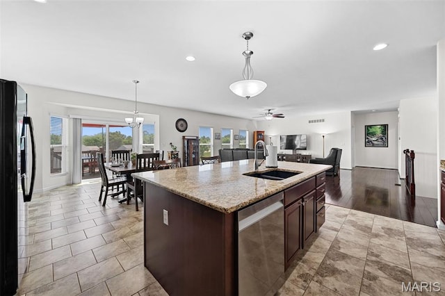 38 Crystal Manor Ct, Wentzville, MO 63385 - kitchen featuring a sink, dishwasher, black refrigerator with ice dispenser, ceiling fan, and a center island with sink