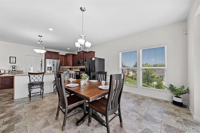 38 Crystal Manor Ct, Wentzville, MO 63385 - dining room with stone finish flooring, baseboards, a chandelier, and recessed lighting