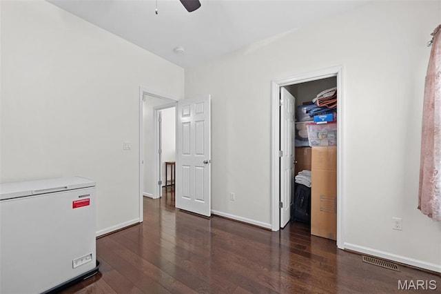 38 Crystal Manor Ct, Wentzville, MO 63385 - unfurnished bedroom with white fridge, wood finished floors, and baseboards