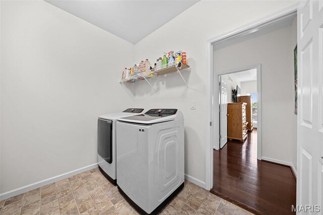 38 Crystal Manor Ct, Wentzville, MO 63385 - washroom featuring independent washer and dryer, baseboards, and stone finish flooring
