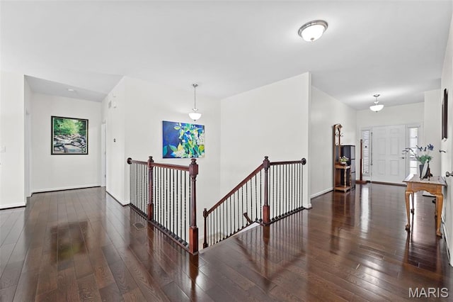 38 Crystal Manor Ct, Wentzville, MO 63385 - hallway featuring an upstairs landing, hardwood / wood-style flooring, and baseboards