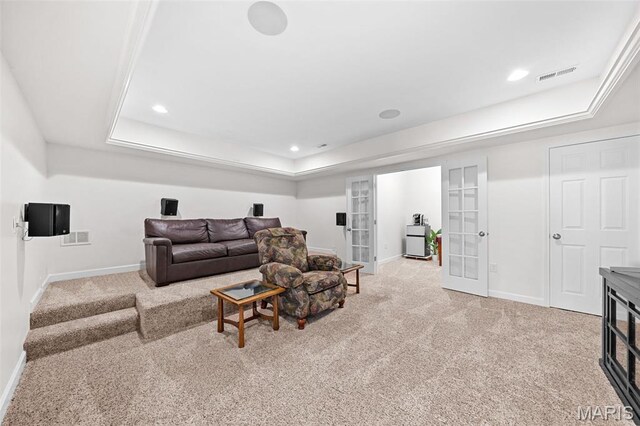 38 Crystal Manor Ct, Wentzville, MO 63385 - living room with baseboards, carpet, french doors, a tray ceiling, and recessed lighting
