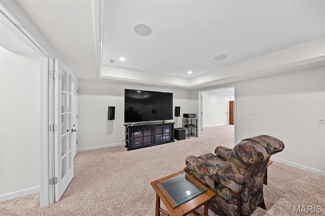 38 Crystal Manor Ct, Wentzville, MO 63385 - living area with carpet floors, baseboards, recessed lighting, french doors, and a tray ceiling