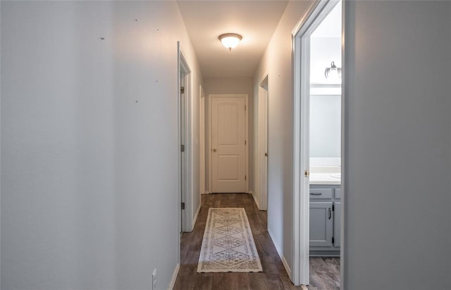 20336 Scholar Ln, Waynesville, MO 65583 - corridor with dark wood-type flooring and baseboards