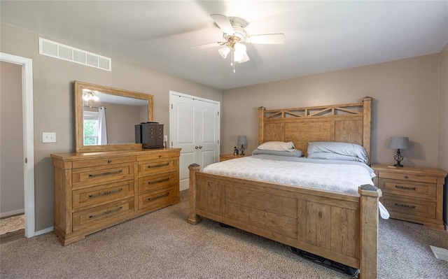 20336 Scholar Ln, Waynesville, MO 65583 - bedroom featuring light colored carpet, a ceiling fan, and a closet