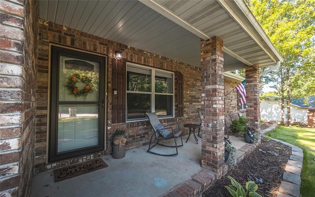 20336 Scholar Ln, Waynesville, MO 65583 - property entrance with a porch and brick siding