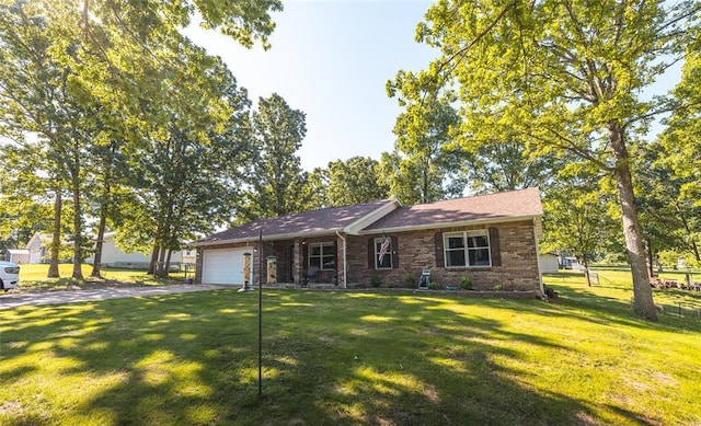 20336 Scholar Ln, Waynesville, MO 65583 - view of front of house with an attached garage, driveway, and brick siding