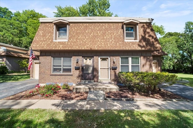 11846 Sologne Ct, Maryland Heights, MO 63043 - view of front facade with roof with shingles, mansard roof, and brick siding