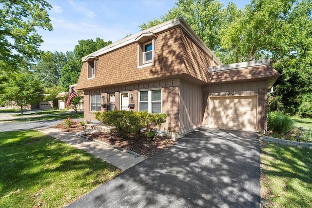 11846 Sologne Ct, Maryland Heights, MO 63043 - view of front of property featuring an attached garage, brick siding, and driveway