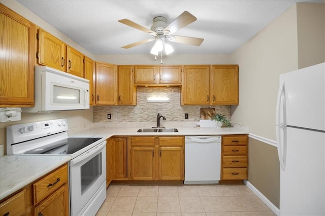 11846 Sologne Ct, Maryland Heights, MO 63043 - kitchen with white appliances, a sink, decorative backsplash, light countertops, and light tile patterned floors