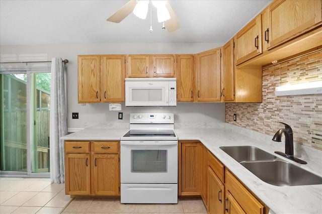 11846 Sologne Ct, Maryland Heights, MO 63043 - kitchen with white appliances, a sink, light tile patterned flooring, ceiling fan, and decorative backsplash