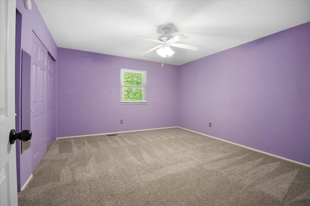 11846 Sologne Ct, Maryland Heights, MO 63043 - unfurnished bedroom with carpet flooring, a closet, baseboards, and a textured ceiling