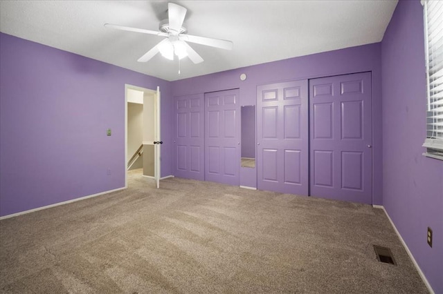 11846 Sologne Ct, Maryland Heights, MO 63043 - unfurnished bedroom featuring two closets, carpet flooring, ceiling fan, and baseboards