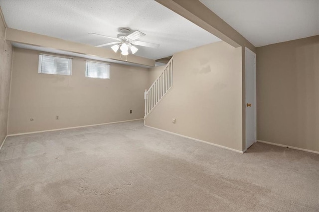 11846 Sologne Ct, Maryland Heights, MO 63043 - basement with baseboards, carpet, a ceiling fan, and stairs