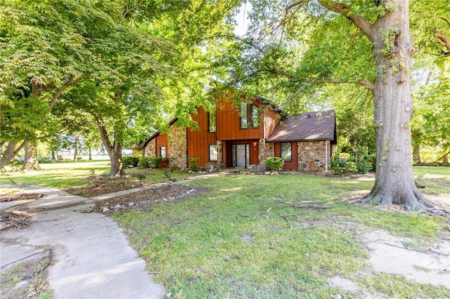 22 Greenbriar Dr, New Madrid, MO 63869 - view of front of property featuring stone siding and a front lawn