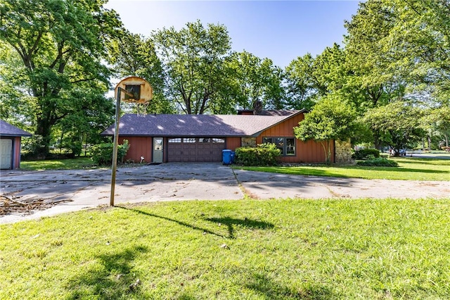 22 Greenbriar Dr, New Madrid, MO 63869 - view of front of property with concrete driveway, a front yard, and an attached garage