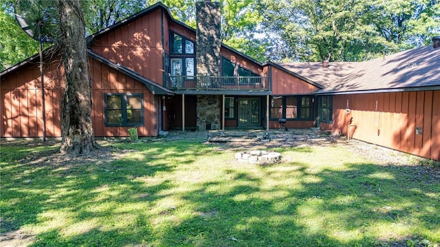 22 Greenbriar Dr, New Madrid, MO 63869 - rear view of house featuring a yard and a chimney