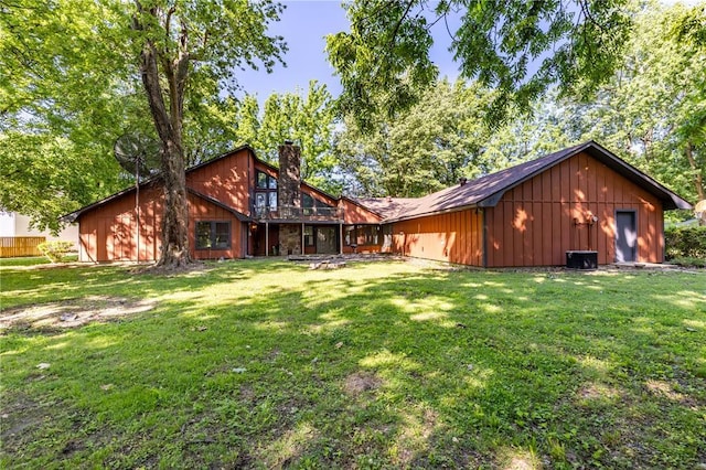 22 Greenbriar Dr, New Madrid, MO 63869 - view of property exterior featuring a chimney and a yard