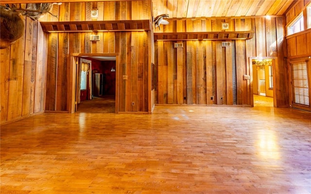 22 Greenbriar Dr, New Madrid, MO 63869 - unfurnished living room with wood walls and wood finished floors