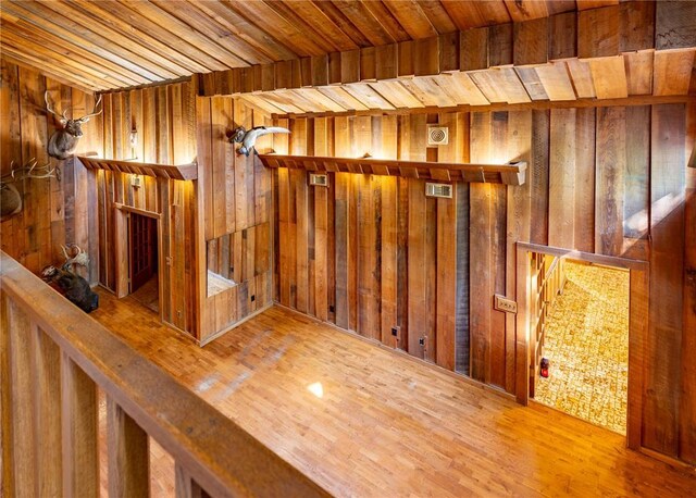 22 Greenbriar Dr, New Madrid, MO 63869 - hallway with wooden walls, wood ceiling, and wood finished floors