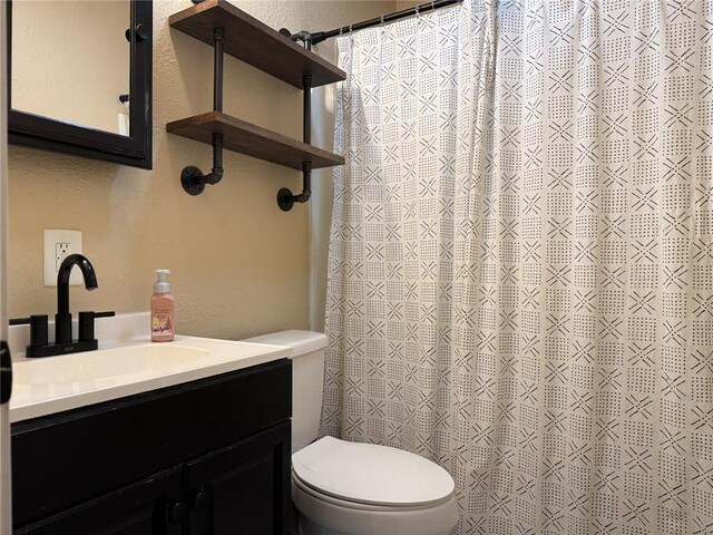 7729 Humbert Rd, Godfrey, IL 62035 - bathroom featuring vanity, toilet, and a shower with curtain