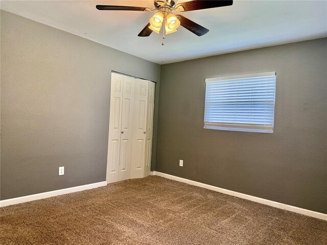 7729 Humbert Rd, Godfrey, IL 62035 - unfurnished bedroom featuring carpet flooring, a closet, ceiling fan, and baseboards