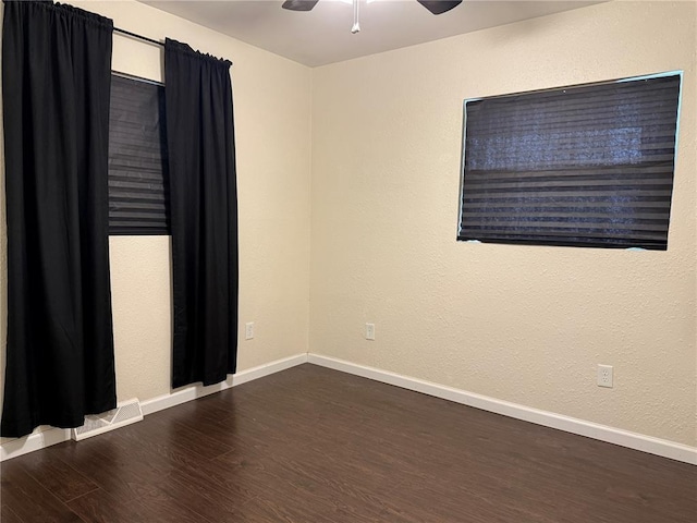 7729 Humbert Rd, Godfrey, IL 62035 - unfurnished room featuring wood finished floors, a ceiling fan, and baseboards