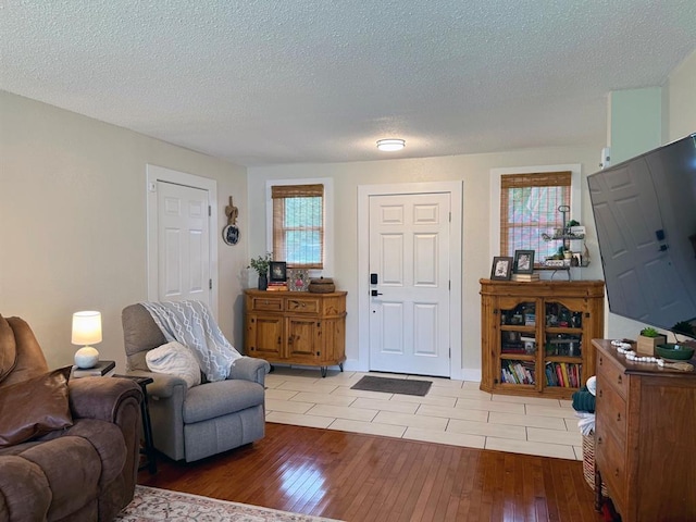 11181 Shady Ln, Dexter, MO 63841 - foyer entrance with light wood-style flooring and a textured ceiling