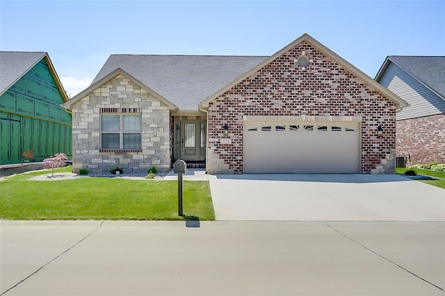 2024 Ravenel, Swansea, IL 62226 - view of front of house featuring an attached garage, concrete driveway, a front yard, stone siding, and brick siding
