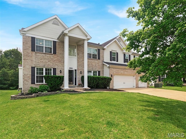 1165 Nooning Tree Dr, Chesterfield, MO 63017 - greek revival inspired property featuring brick siding, concrete driveway, an attached garage, and a front lawn