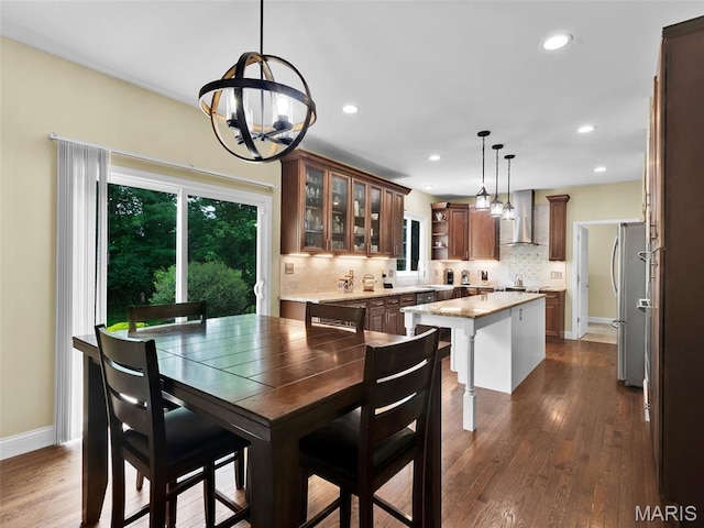 1165 Nooning Tree Dr, Chesterfield, MO 63017 - dining area featuring a chandelier, recessed lighting, dark wood-style flooring, and baseboards
