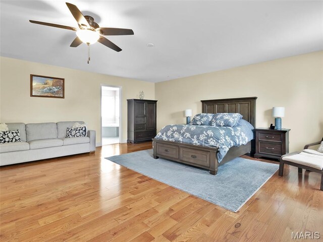 1165 Nooning Tree Dr, Chesterfield, MO 63017 - bedroom with light wood finished floors and ceiling fan