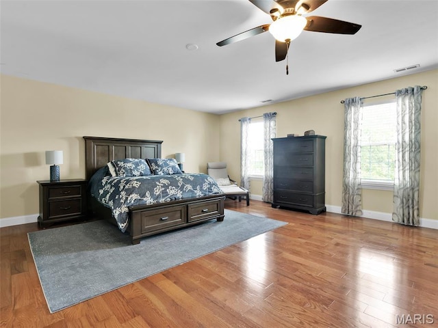 1165 Nooning Tree Dr, Chesterfield, MO 63017 - bedroom featuring wood finished floors, baseboards, and a ceiling fan