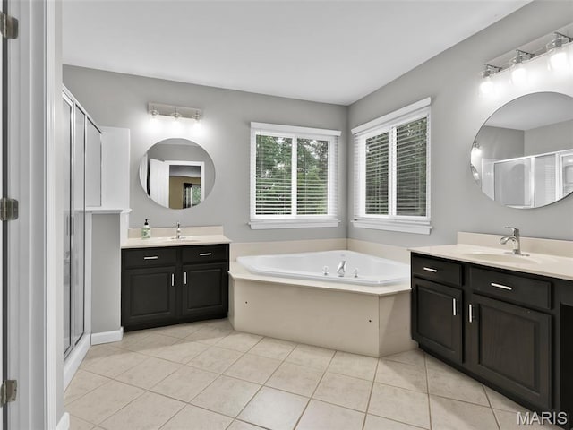 1165 Nooning Tree Dr, Chesterfield, MO 63017 - full bathroom with two vanities, a garden tub, a shower stall, and tile patterned flooring
