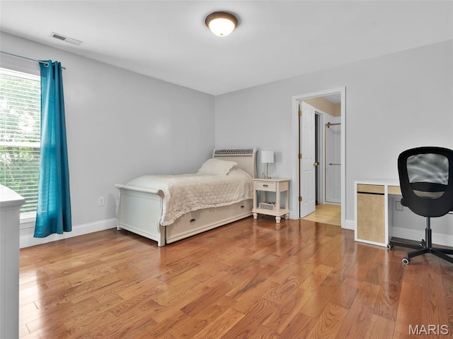1165 Nooning Tree Dr, Chesterfield, MO 63017 - bedroom with wood finished floors and baseboards