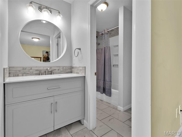 1165 Nooning Tree Dr, Chesterfield, MO 63017 - full bath featuring marble finish floors, vanity, shower / tub combo with curtain, tasteful backsplash, and baseboards