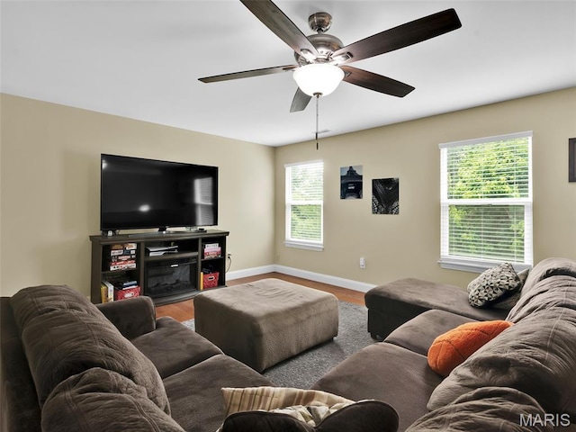 1165 Nooning Tree Dr, Chesterfield, MO 63017 - living room featuring ceiling fan, baseboards, and wood finished floors
